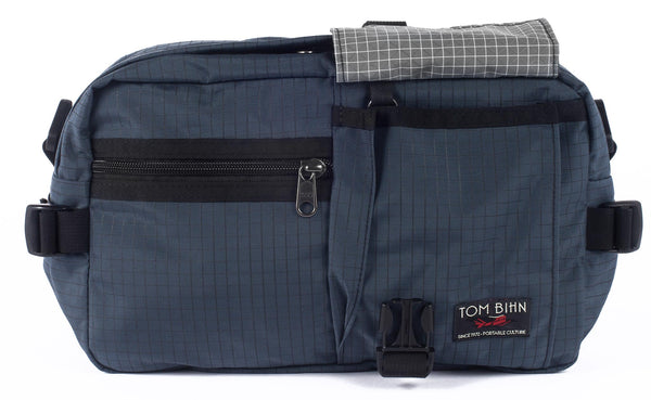 The LGD in Night Walk/Black/Northwest Sky. Front view, front buckle pocket lifted up to show the Northwest Sky lining.